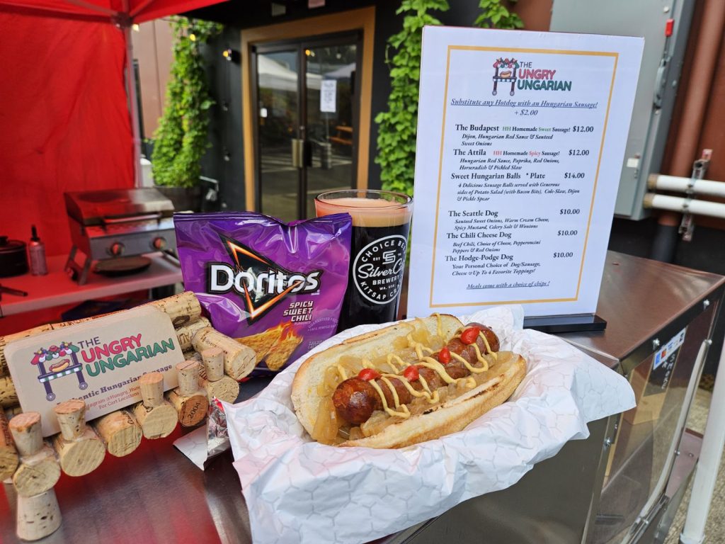 Hungarian sausage hot dog with chips and beer